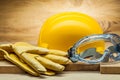 Leather working gloves yellow helmet and transparent blue goggles Royalty Free Stock Photo