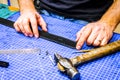 Leather workshop master holds a black belt