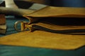 Leather workshop Yellow leather and tools on the table