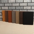 Leather Zipper Portfolio. Concept shot, top view, flap portfolio in brown colors and leather pen. Custom background flap portfolio Royalty Free Stock Photo