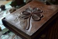 leatherbound journal with a fourleaf clover embossed on it