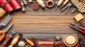 Leathercraft tools arranged on wood, workspace background Royalty Free Stock Photo