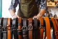 leatherworker setting up a display of belts Royalty Free Stock Photo