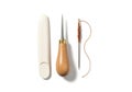 Leatherworking Tools: Awl, Needle, and Thread on a White Background Royalty Free Stock Photo