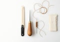 Leatherworking Tools and Materials Laid Out on a White Surface Royalty Free Stock Photo