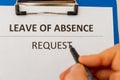 Leave of absence request on the tablet at the table.