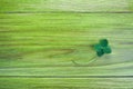 Leave clover on green wooden background. Greeting happy Four leaf clover. Luck concept. Patrick day symbol.