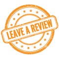 LEAVE A REVIEW text on orange grungy round rubber stamp