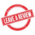 LEAVE A REVIEW text on red grungy round stamp