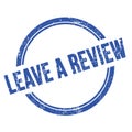LEAVE A REVIEW text written on blue grungy round stamp