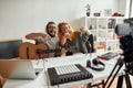 Leave your comment down below. Man and woman having fun while making music. Couple of musicians recording video blog or