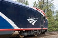 Closeup of Amtrak ALC-42 locomotive on curved track