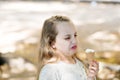 It leaves a bad taste in the mouth. Cute little girl dislike taste of ice cream. Small child licking ice cream with