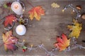 leaves, foliage, garland, candles, top view of wooden table, concept happy Thanksgiving, good weather concept, outdoor tea party, Royalty Free Stock Photo