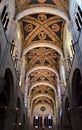 It leaves, towards the entrance, of the central frescoed nave of the cathedral of Lucca, illuminated by the light that enters thro