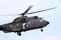 Leaving a flying dutch air force helicopter Royalty Free Stock Photo