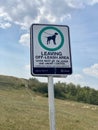 Leaving Off-Leash Area sign. Dogs must be under control on leash and under control. Owner must remove defecation immediately.