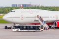 Leaving passengers from the large airliner by stairs and boarding buses. Russia, Moscow Sheremetyevo, 15 august 2018 Royalty Free Stock Photo