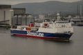 Leaving port, Roll on roll off ferry with deck cargo departs Belfast docks. Northern Ireland. Royalty Free Stock Photo