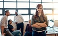 Leaving productivity in the hands of my team. Portrait of a confident young businesswoman standing in a modern office Royalty Free Stock Photo