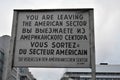 Leaving sign at Checkpoint Charlie in Russian French English and German in Berlin Germany