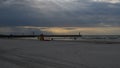 Leba beach afer rainy day, sun rays pass through the clouds, Poland