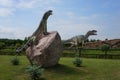 Leba, Poland - July 23, 2013: Models of dinosaurs Allosaurus and The Komodo dragon