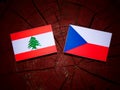 Lebanese flag with Czech flag on a tree stump