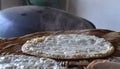 Lebanese food arabic bread and cheese, called mankouche in arabic, in lebanon, being cooked on a convex iron plate. Royalty Free Stock Photo