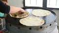 Lebanese food: Manakish. A cook who prepares a man`ousheh manoushe, manakeesh