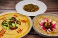 Lebanese meze, hummus, aubergine caviar and okra in tomato sauce