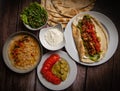 Lebanese recipe of chich taouk, garlic cream, toum, in a Lebanese bread, tabbouleh and chickpea puree, hummus