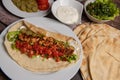 Lebanese recipe of chich taouk, garlic cream, toum, in a Lebanese bread, tabbouleh and chickpea puree, hummus