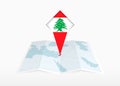 Lebanon is depicted on a folded paper map and pinned location marker with flag of Lebanon Royalty Free Stock Photo