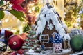 Gingerbread house with Christmas decoration and bokeh