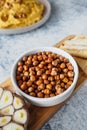 Leblebi Turkish delicacy of fried chickpeas, garlic and tortillas on compartmental dish, vertical food content, selective focus Royalty Free Stock Photo