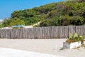 Signpost on the beach of Torre dell`Orso, I Caraibi del Salento the caribbean of Salento in Italian.