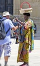 Street saleswoman with basket on the head