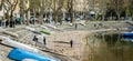 LECCO, ITALY - APRIL 2022: Tourists and locals spending sunny spring day in Lecco, a town on the shore of Lake Como. Charming