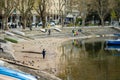 LECCO, ITALY - APRIL 2022: Tourists and locals spending sunny spring day in Lecco, a town on the shore of Lake Como. Charming