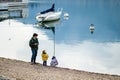 LECCO, ITALY - APRIL 2022: Tourists and locals spending sunny spring day in Lecco, a town on the shore of Lake Como. Charming