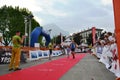 Sportsman arriving at the finish of `Lecco city - Resegone mountain` running marathon event.