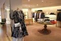 Fendi Handbag and Designer Dress in Fashion Store Interior