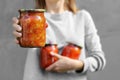 Lecho. LecsÃÂ³. Tinned tomatoes with peppers. Conservation in hand close up Royalty Free Stock Photo