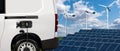 lectric van on a background of solar panel and wind turbines. Royalty Free Stock Photo