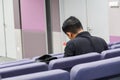 Lecture hall with grey chairs in university.