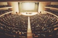 Lecture in a large university auditorium to a group of students aerial view. AI generated. Royalty Free Stock Photo