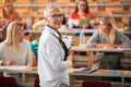 Lecture at university. speaker giving presentation in lecture hall at university Royalty Free Stock Photo