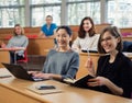 Lecturer and multinational group of students in an auditorium Royalty Free Stock Photo