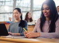 Lecturer and multinational group of students in an auditorium